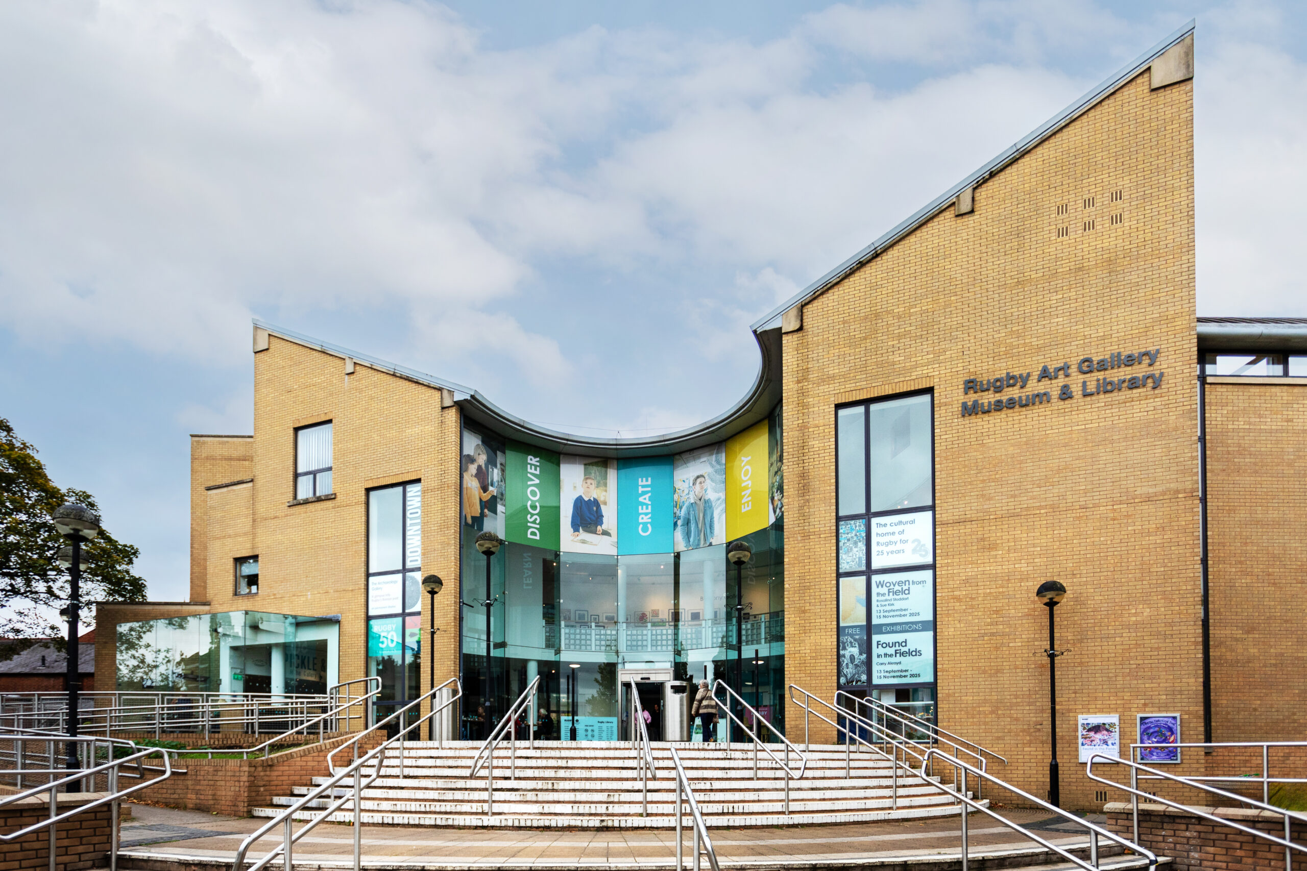 Modern curved brick and glass building of Rugby Art Gallery, Museum and Library