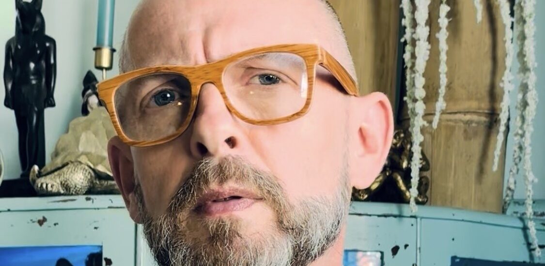 bald man with glasses