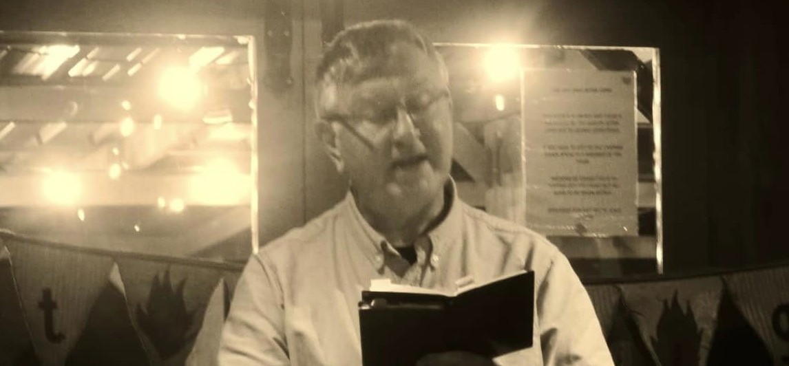 Man reading from a book