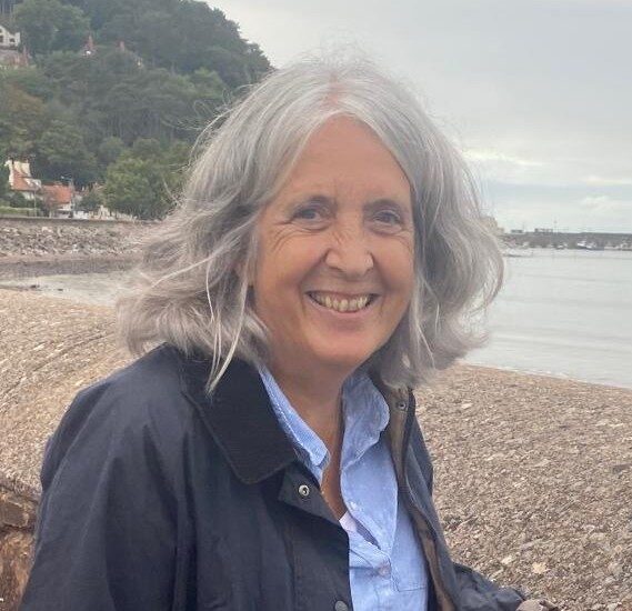 portrait of a woman on a pebble beach