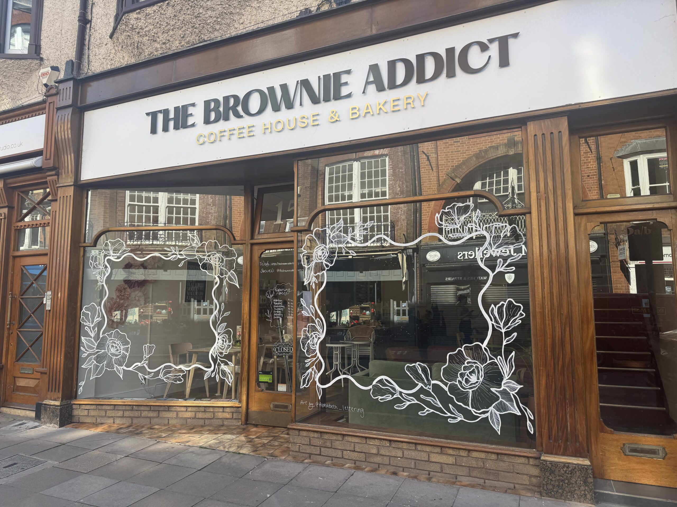 Hand painted shop front window at The Brownie Addict bakery