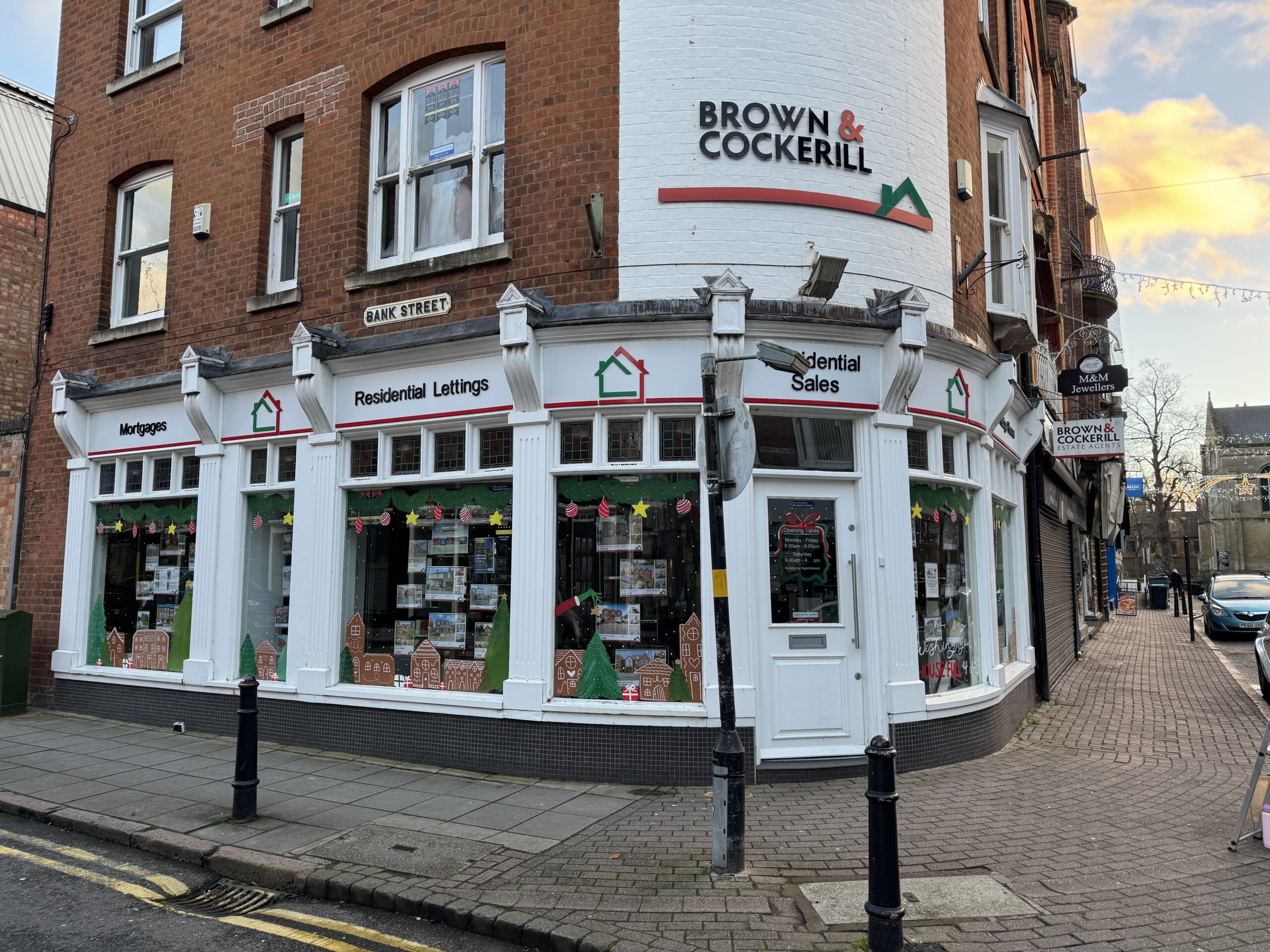 Hand painted shop front windows on a business in Rugby town centre
